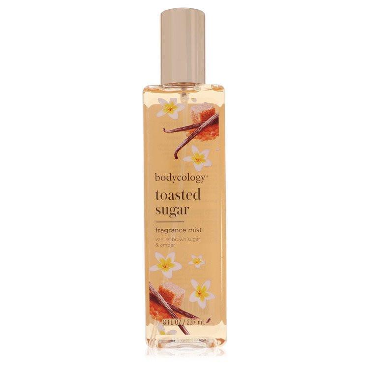 מיסט גוף Bodycology Toasted Sugar בניחוח חמים של סוכר קלוי, וניל וענבר זהוב באריזה אלגנטית ומזמינה