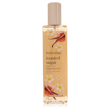 מיסט גוף Bodycology Toasted Sugar בניחוח חמים של סוכר קלוי, וניל וענבר זהוב באריזה אלגנטית ומזמינה