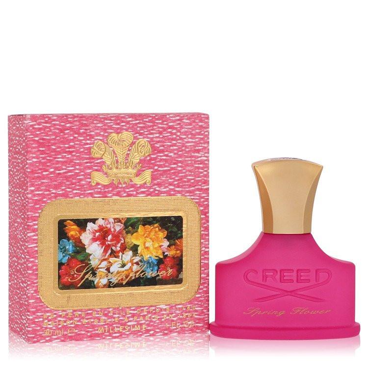 בושם יוקרתי ואצילי לאישה Creed Spring Flower Millésime בבקבוק ורוד איקוני וניחוח פרחוני-פירותי זוהר המשלב אפרסק ויסמין