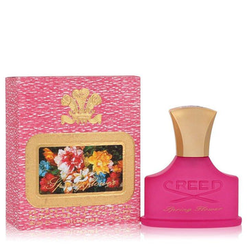 בושם יוקרתי ואצילי לאישה Creed Spring Flower Millésime בבקבוק ורוד איקוני וניחוח פרחוני-פירותי זוהר המשלב אפרסק ויסמין